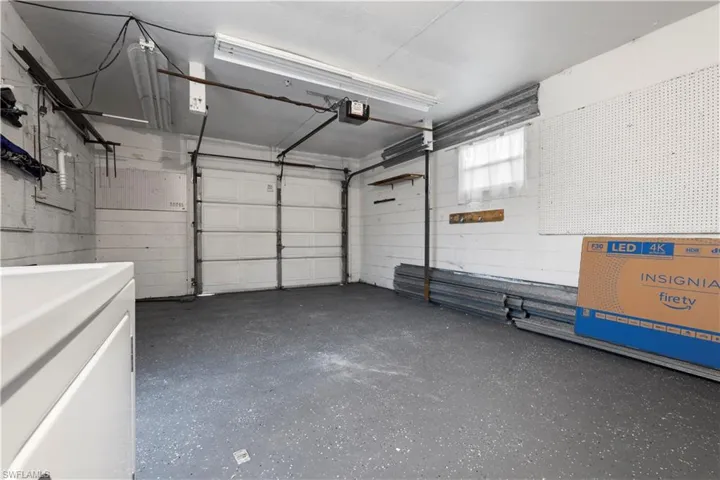 Garage featuring a garage door opener