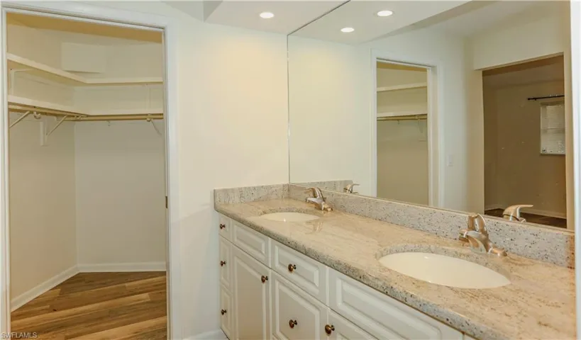 Dual vanity with granite countertop and integrated sinks