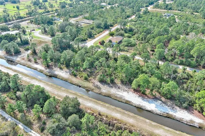 Aerial overview of property's location featuring a large body of water