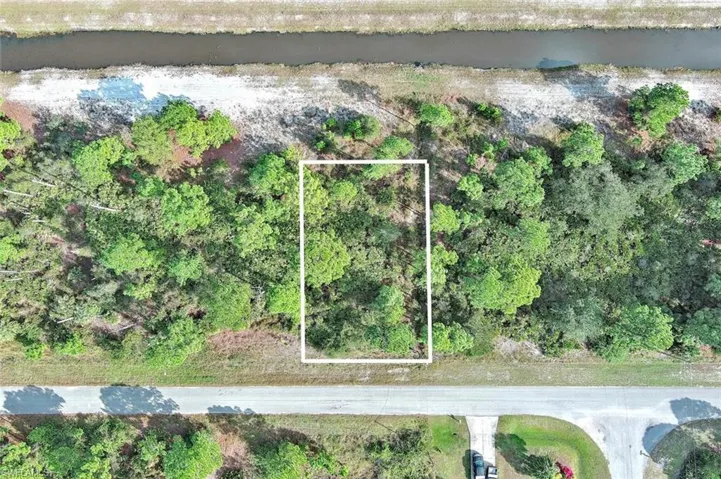 Aerial overview of property's location with property parcel outlined