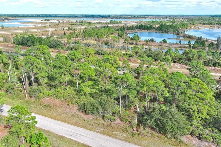 Aerial overview of property's location featuring a large body of water