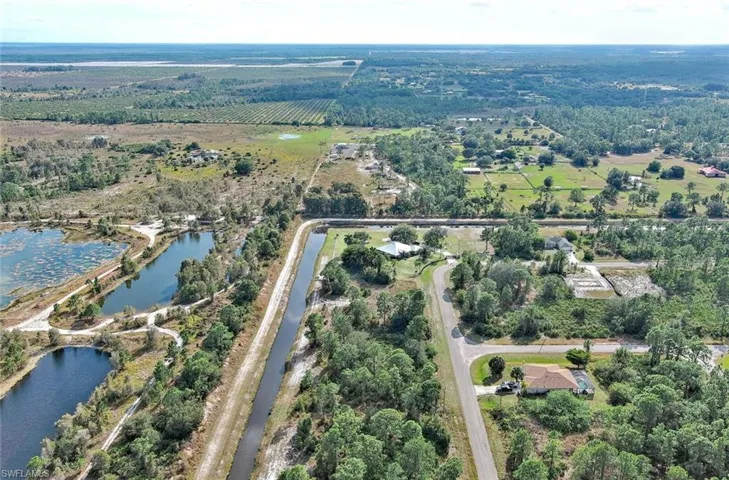 Aerial overview of property's location with extensive farmland and rural landscape