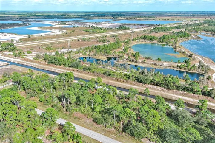 Aerial overview of property's location featuring a large body of water