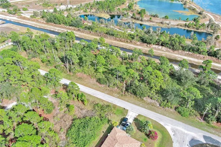 Aerial overview of property's location featuring a large body of water