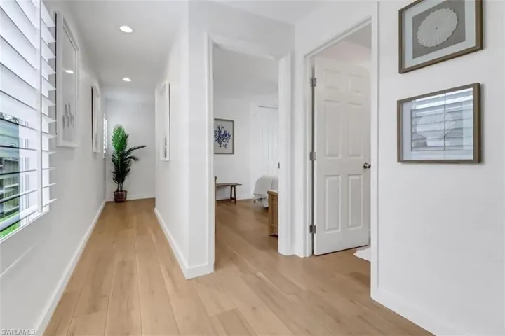 Hall featuring light wood-type flooring