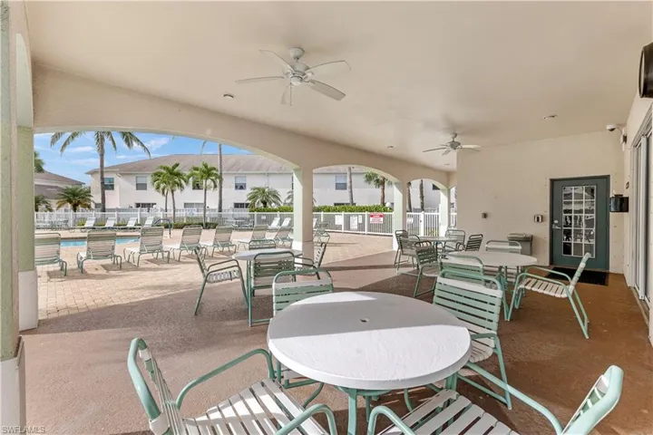 View of patio / terrace featuring ceiling fan and a community pool