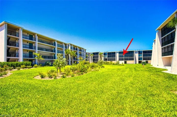 View of community featuring a lawn