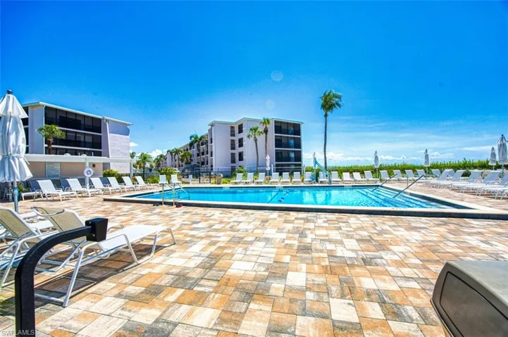 Community pool featuring a patio area