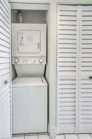 Laundry stacked washing machine and dryer