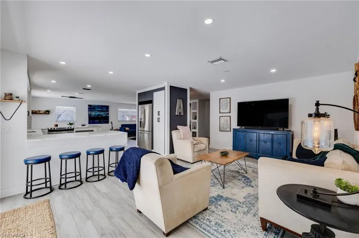 Living room featuring recessed lighting and light wood-type flooring