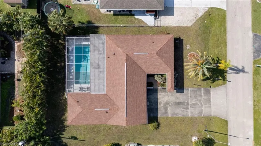 View of subject property with a pool area