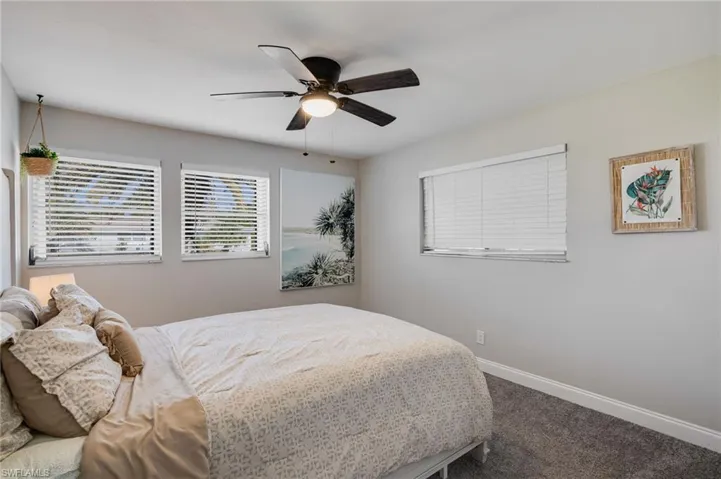 Bedroom featuring carpet and ceiling fan