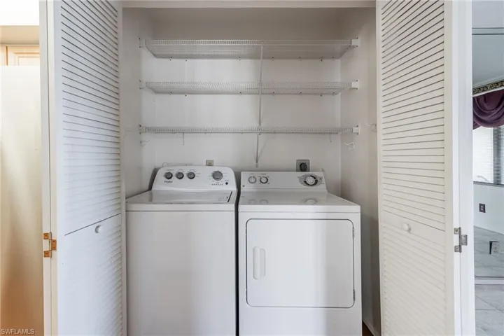 Laundry area featuring independent washer and dryer