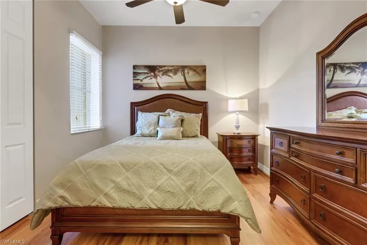 Bedroom with light wood-style flooring and ceiling fan