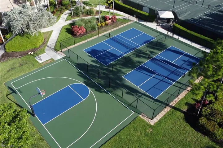 View of sport court featuring a tennis court and community basketball court