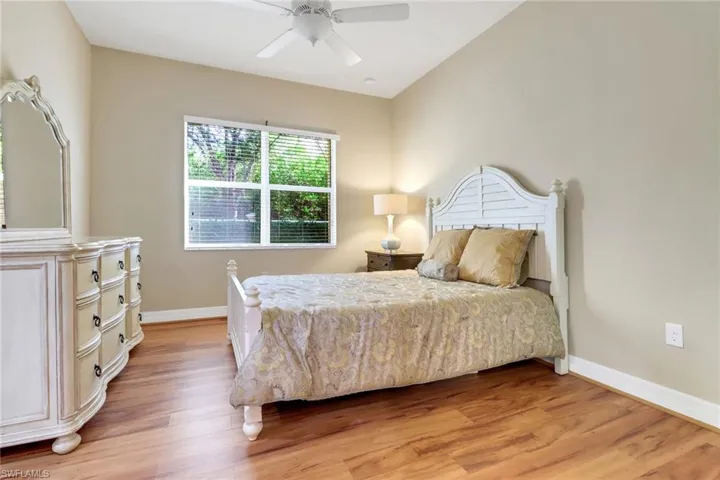 Bedroom featuring light wood-type flooring and a ceiling fan