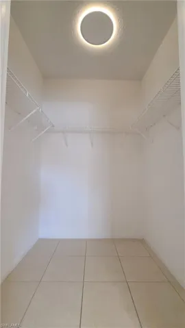 Walk-in closet with LED light (dimmed night light feature turned on).