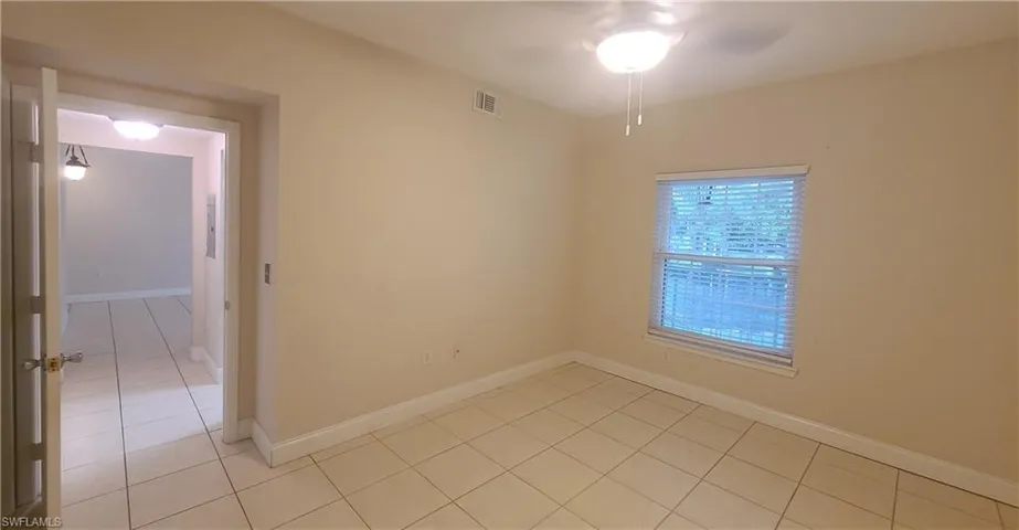 view of bedroom, from walk-in closet towards window.