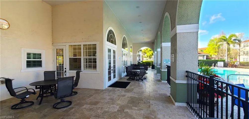 The shaded area between pool and clubhouse.