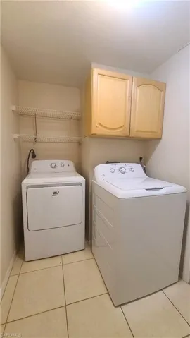 View of laundry room, with new washer and dryer.