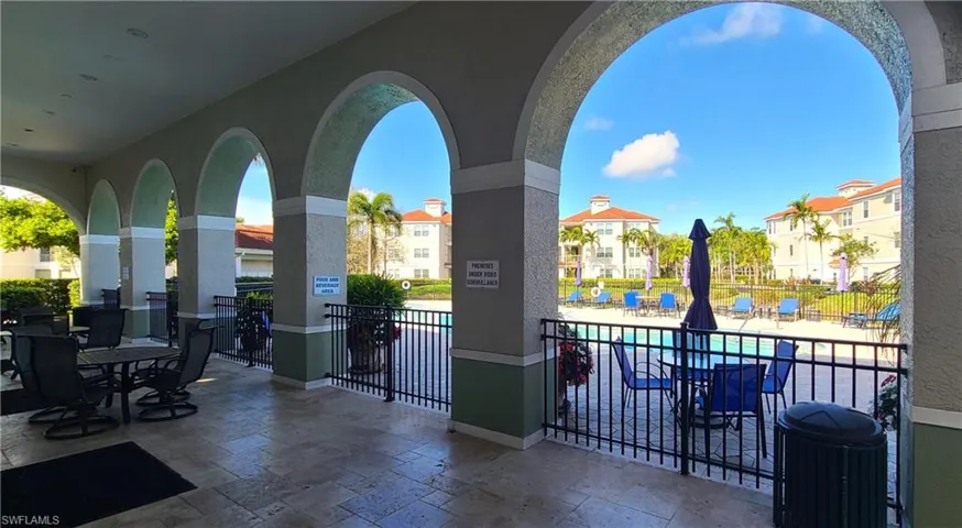 The shaded area between pool and clubhouse.