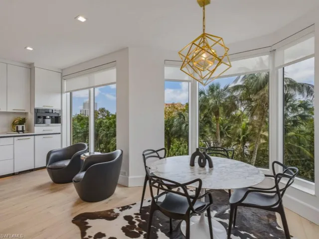 Dining space featuring light wood-style floors and a chandelier