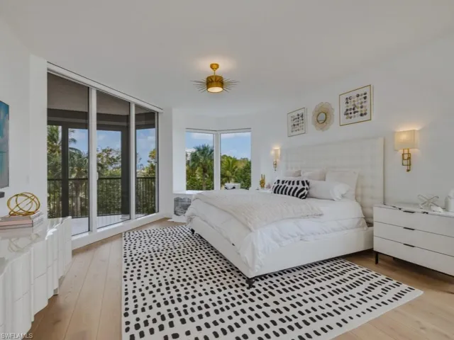 Bedroom featuring light wood finished floors and access to exterior