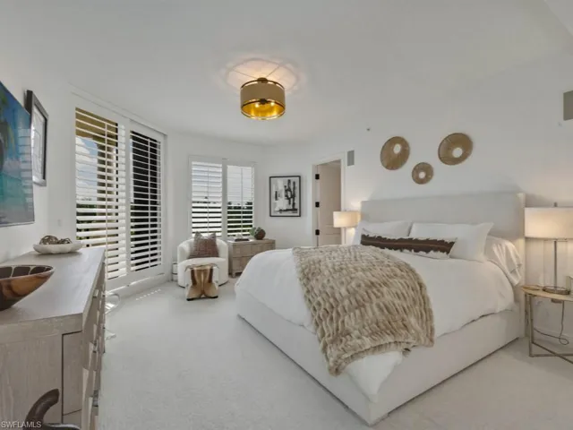 Bedroom with light carpet