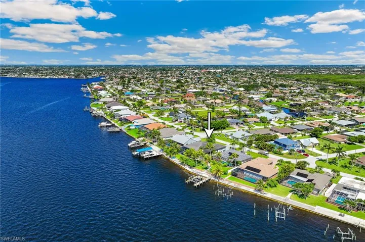 Aerial view of residential area with a nearby body of water