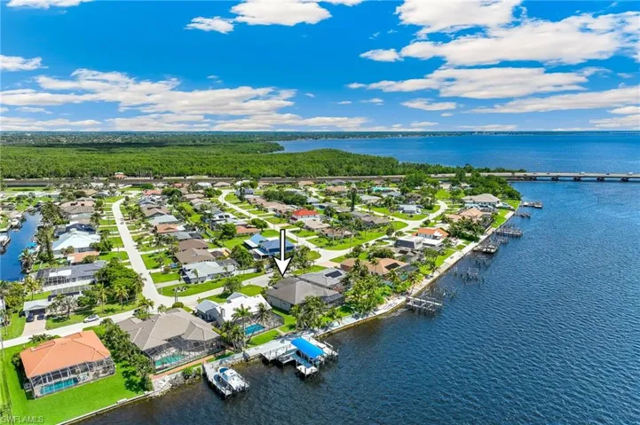 Aerial view of residential area with a large body of water