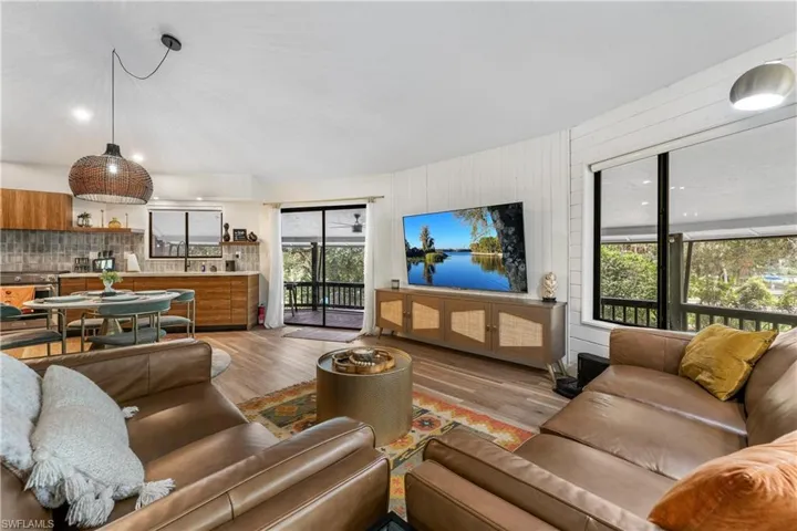 Living room featuring a wealth of natural light and light hardwood / wood-style floors