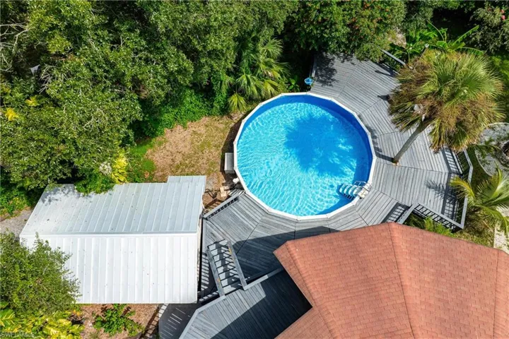 View of pool featuring a deck
