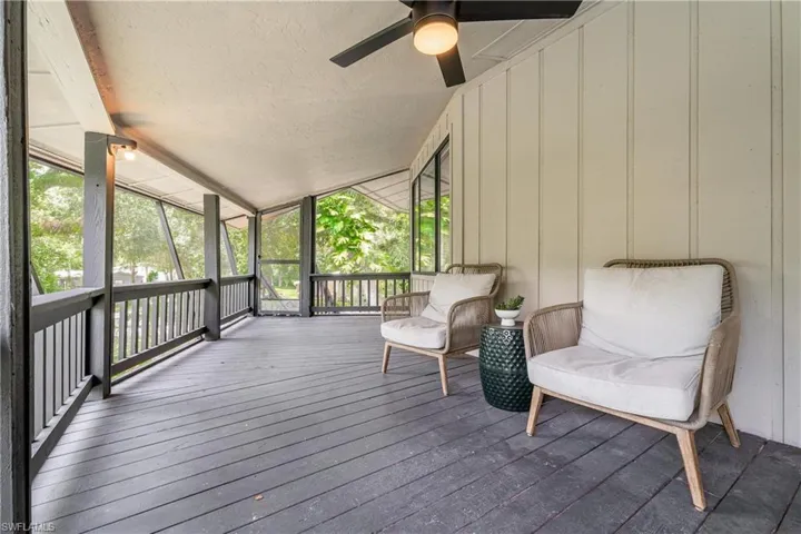 Sunroom / solarium with plenty of natural light, ceiling fan, and vaulted ceiling