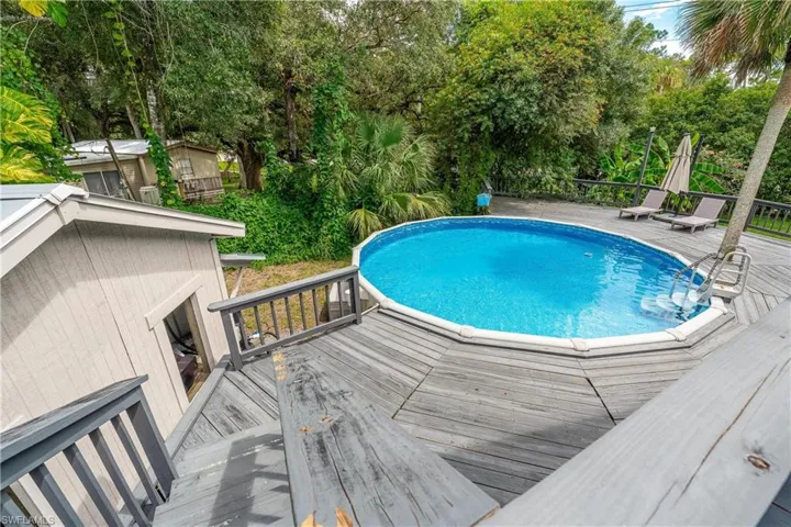View of swimming pool featuring a wooden deck