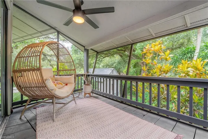 Sunroom featuring ceiling fan