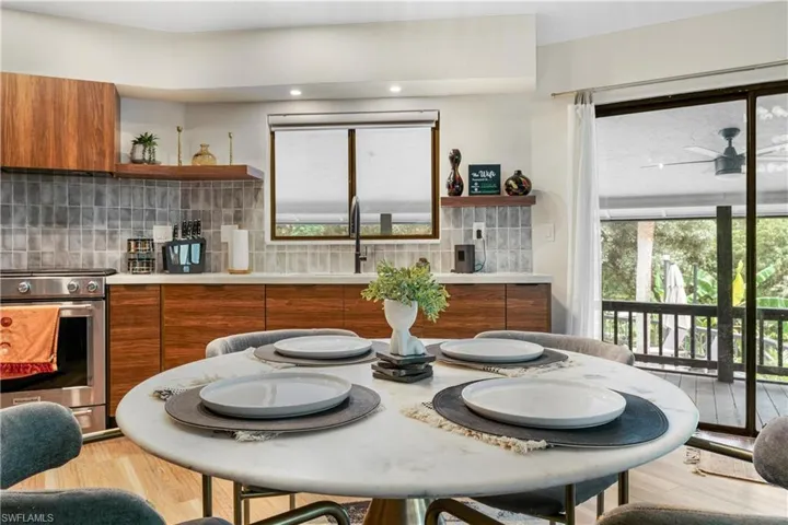 Dining space featuring sink and light wood-type flooring