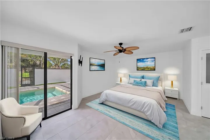 Bedroom featuring access to exterior and ceiling fan