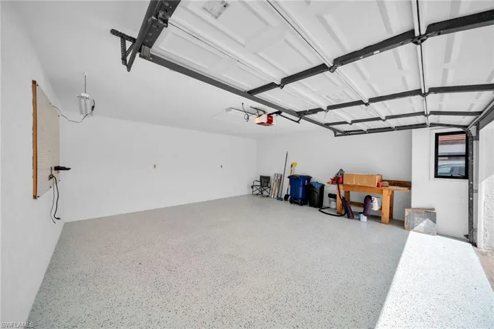 Garage featuring a garage door opener
