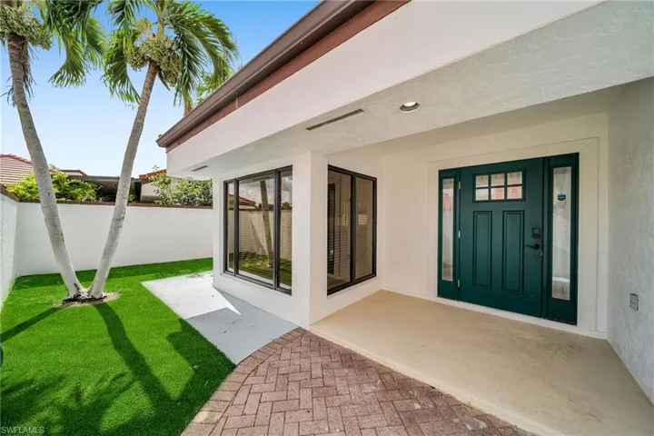 Property entrance with a yard