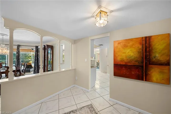 Entry featuring a chandelier and light tile floors
