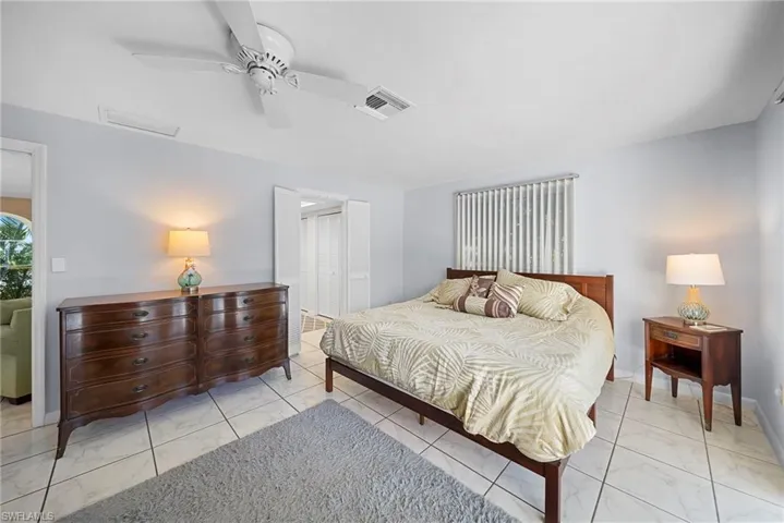 Master Bedroom with ceiling fan and tile flooring