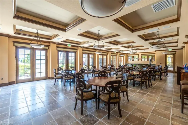 Dining space featuring crown molding, coffered ceiling, and beam ceiling