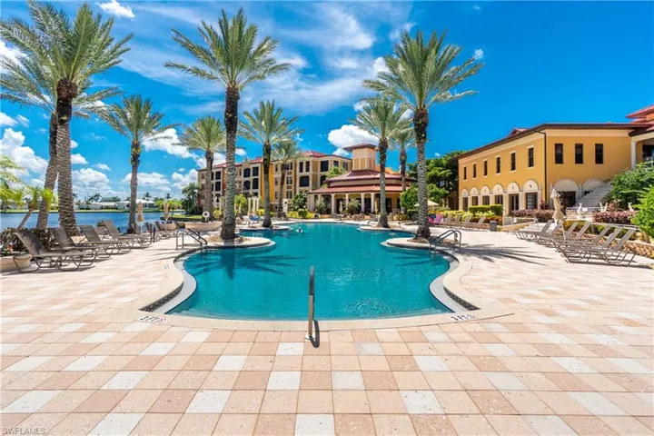 Community pool with a patio