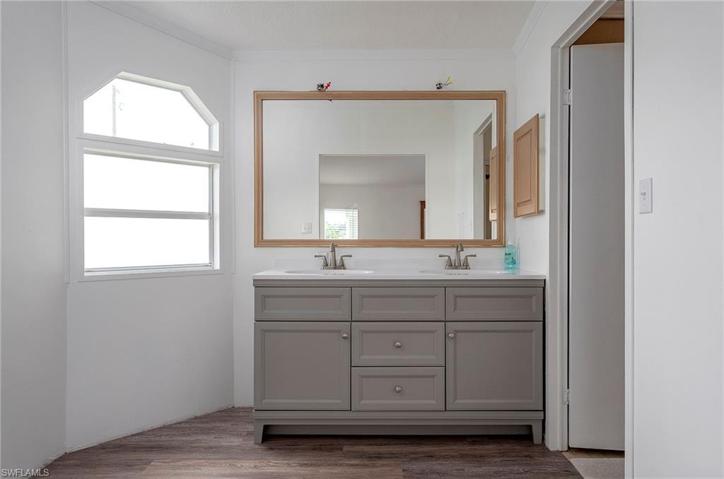 Nicely updated vanity area in primary bathroom