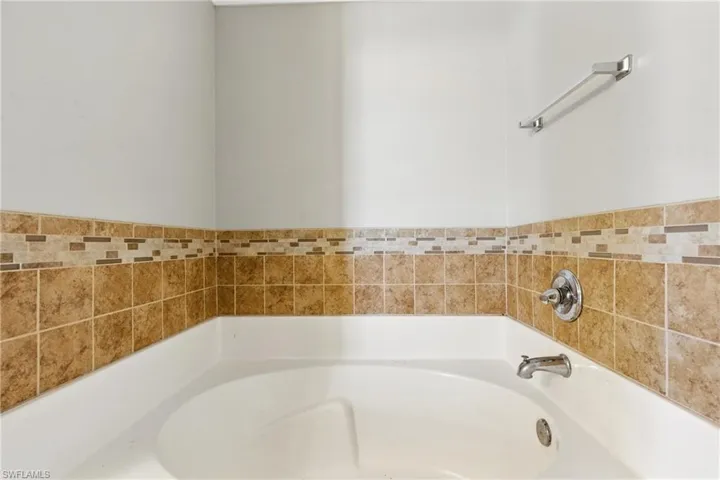 Full bath featuring a garden tub