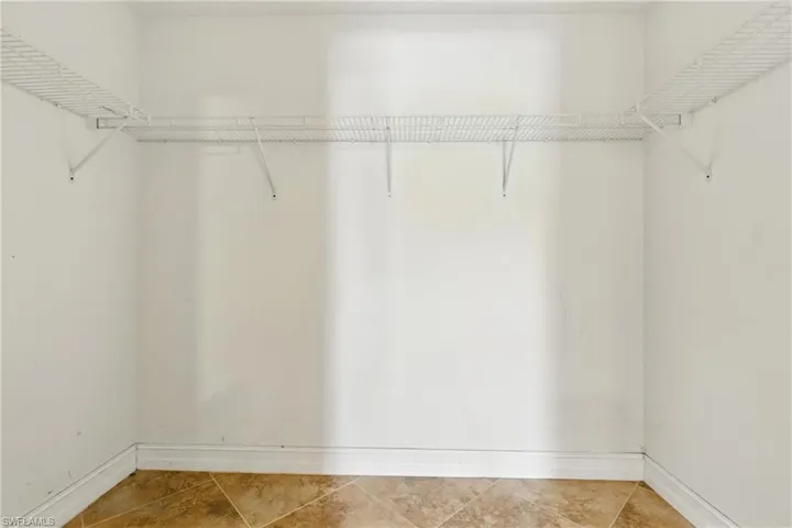 Spacious closet with tile patterned flooring