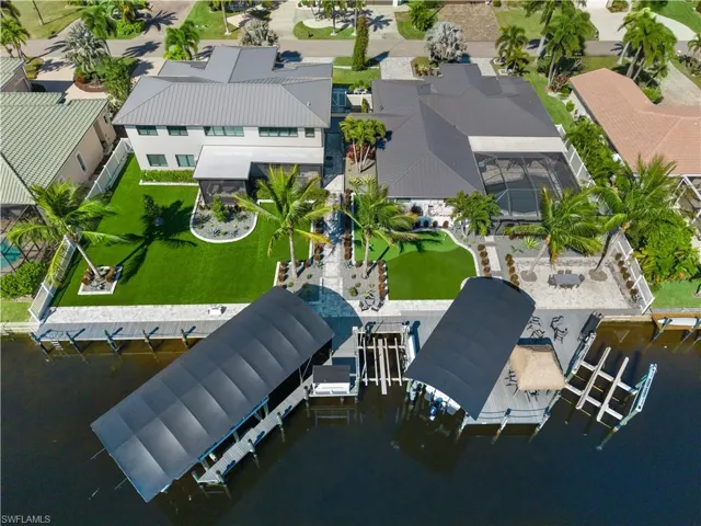 Aerial view of residential area featuring a large body of water