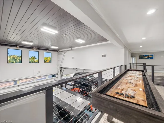 Recreation room featuring crown molding and wooden ceiling