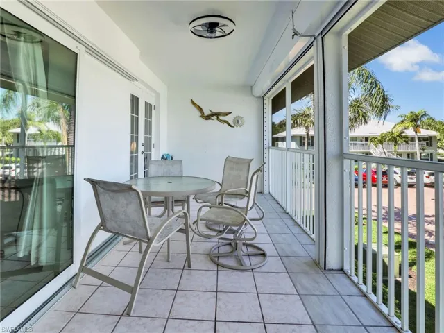 Balcony featuring french doors and outdoor dining area