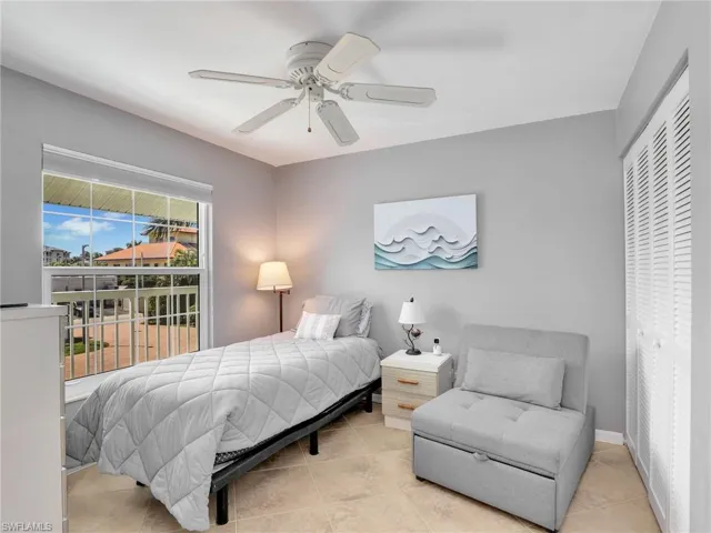 Bedroom featuring tile patterned flooring and a ceiling fan